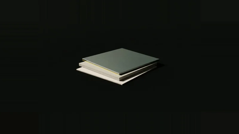 Three thin stacked plates in paper, concrete and grey-green metal, slightly offset so a black wedge-shaped gap opens along…