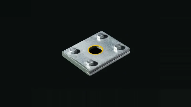 Close overhead view of two bolted galvanised steel splice plates, one bolt hole empty and ringed in yellow.
