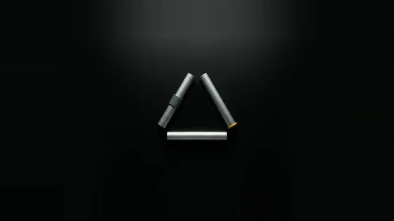 Overhead view of three galvanised conduit lengths radiating from a centre point, none meeting, leaving a small void.