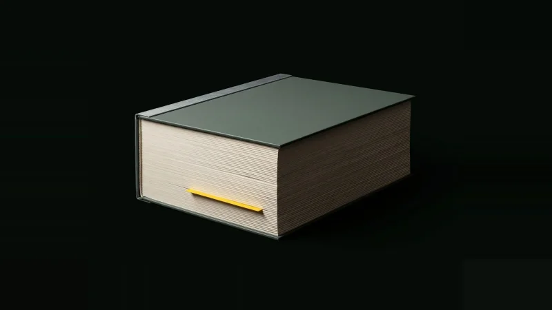 A thick closed project manual lit only at its edges, its layered page block marked by one yellow tab, on black.
