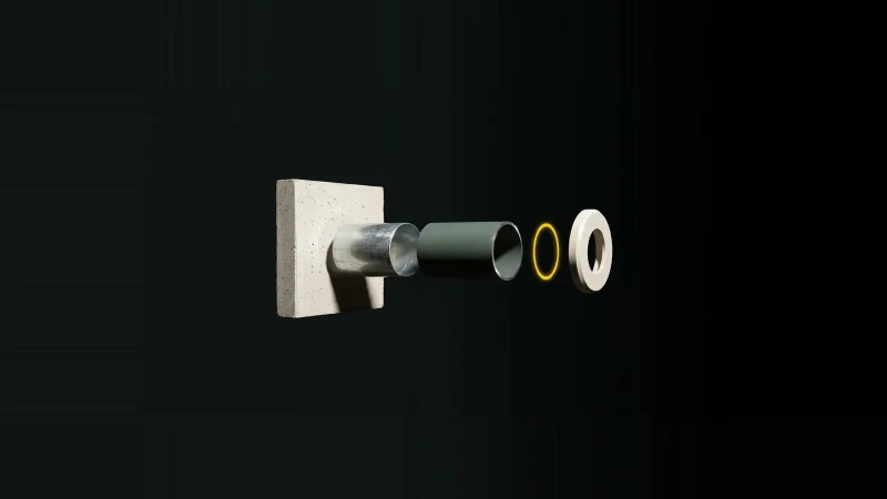Exploded cutaway of a sprinkler pipe penetration through a concrete fire-rated wall, with one layer missing