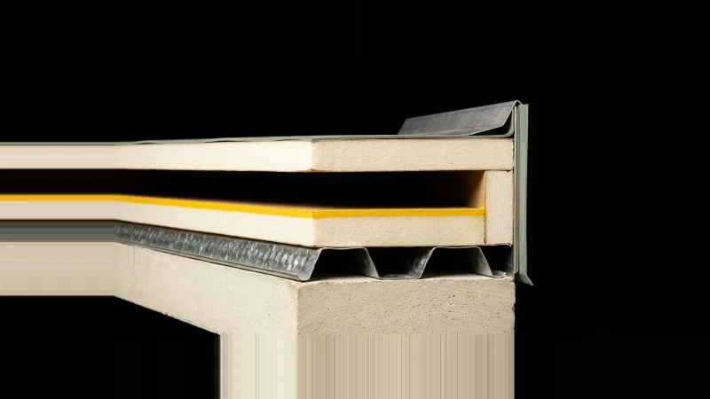 Close-up section of a roof edge assembly with one layer missing, leaving a dark gap marked in yellow.