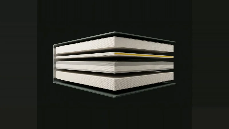 A thick specification book exploded into floating layers of pages, one thin layer edged in yellow light