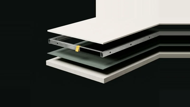 Exploded view of a partition wall assembly floating in darkness, one layer missing and marked by a yellow tab